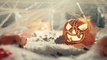 Scary Halloween pumpkin among the smoke of the night