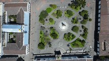 Aerial shot drone flies forward with camera straight down over the main square in Quito