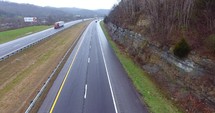 4K Aerial Freeway Cable Cam Right Trucks Transportation Vehicles Driving On Tennessee Road