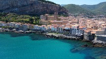 Aerial shot drone seaside shot of Cathedral from north coast of Cefalu, Sicily, Italy