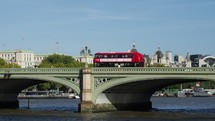 LONDON, UK - CIRCA OCTOBER 2022: Red double decker bus on Westminster Bridge - EDITORIAL USE ONLY