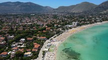 Aerial shot drone flies from south to north on Mondello Beach in Palermo, Sicily, Italy