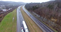 4K Aerial Freeway Circle Left Shot Trucks Transportation Vehicles Driving On Tennessee Road