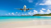 Airplane flies over a Caribbean beach