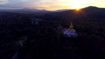 Aerial Giant Buddha Flyover Jungle Sunset 