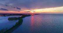 4K Nature Waterway Aerial Great Lakes Beach Sunset Springtime Drone
