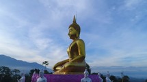 Huge Gold Budda Crane Shot Aerial Drone Statue Towering Mountians Laos Thailand Cinematic