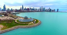 4K Adler Planetarium Chicago Skyline Aerial Circle Shot Buildings City Urban Lake Michigan Water Flying
