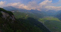 Swiss Alps Aerial Drone Shot Alps Rugged Mountians Push In Countryside Outback Landscape Cliff Evergreen Trees Interlaken Switzerland Nature Grandure Vacation Destination Wilderness