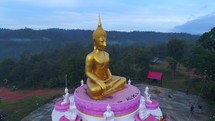 Huge Buddha Aerial Drone Orbit Statue Towering Mountians Laos Thailand