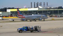 American Airlines aircraft moving along an airport taxiway.