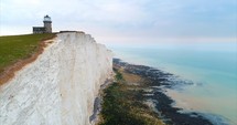 Aerial Lighthouse White Cliffs Ocean England Travel Cinematic Drone