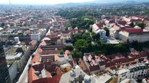 Aerial shot drone flies over Trg bana Josipa Jelačića toward Lotrščak Tower in Zagreb, Croatia