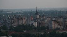 Eastern European Town Skyline At Dusk With Orthodox Church 