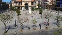 Aerial shot drone flies up and away from Teatro Politeama Garibaldi in the Piazza Ruggero Settimo in Palermo, Sicily, Italy