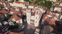Aerial view of roman catholic Cathedral of Saint Tryphon in Kotor, Montenegro, orbiting