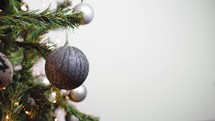 Christmas tree with white ball and copy space on right