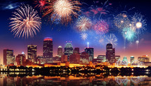 A festive collage of fireworks bursting over a city skyline on Independence Day