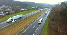 4K Aerial Freeway Circle Shot Trucks Transportation Vehicles Driving On Tennessee Road