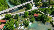 Aerial shot drone flies backwards high in wide shot over Rastoke, Slunj, Croatia