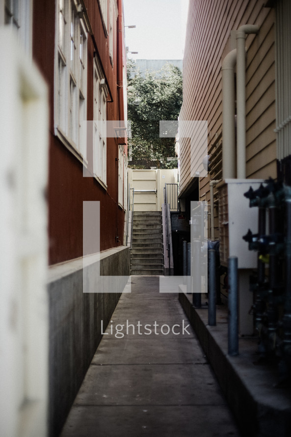 sidewalk between an alley 