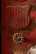 Red, rusty, controls on vintage fire truck