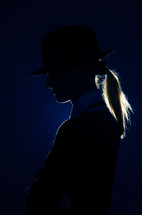 Side-view photo of the woman silhouette with hat