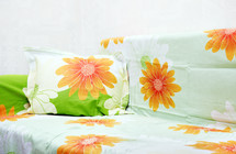 floral sheets on a bed 