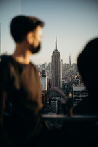a man looking out over NYC 