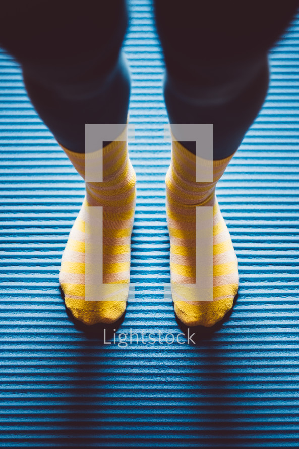 feet in yellow socks 