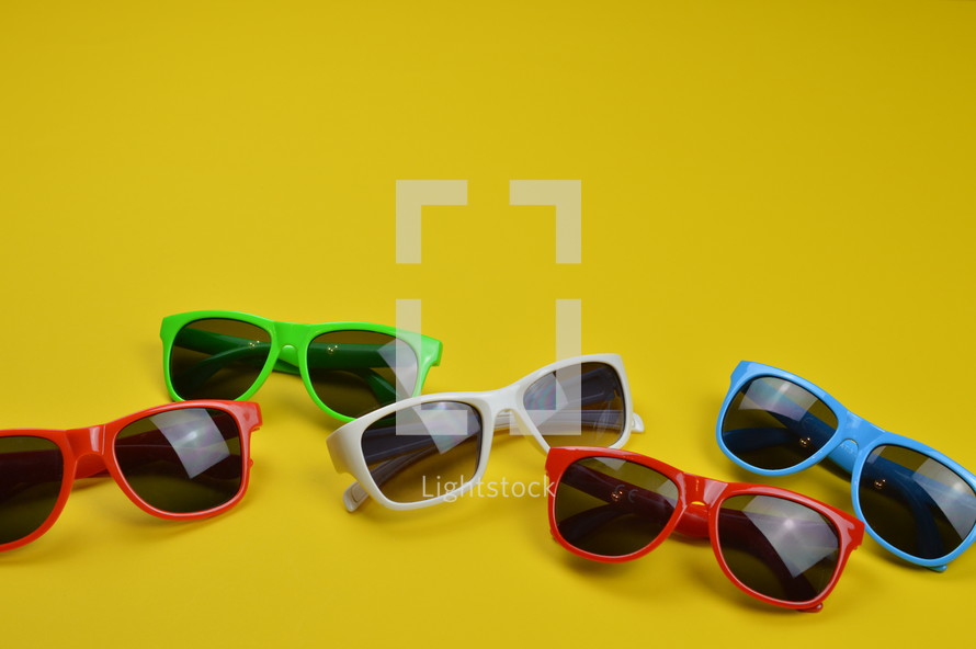 sunglasses on yellow 