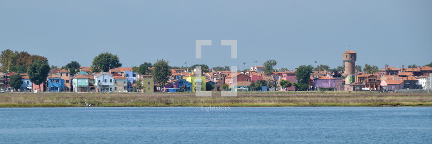 homes in a town along a shore 