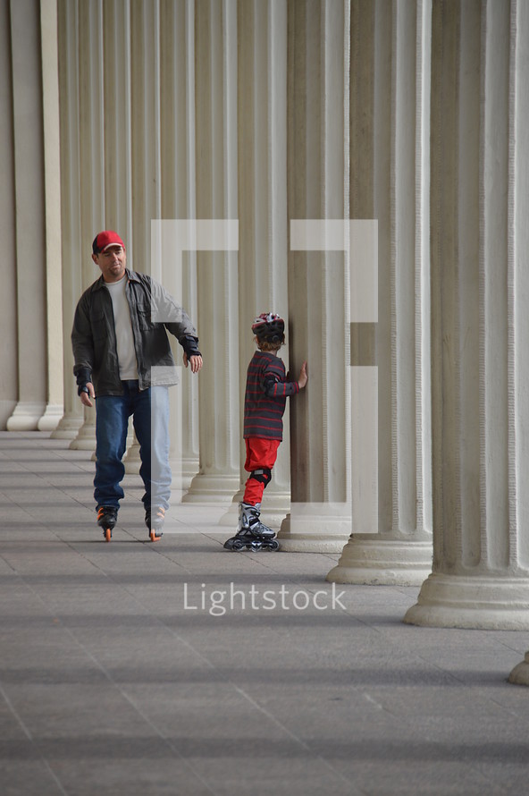 father and son roller blading together 