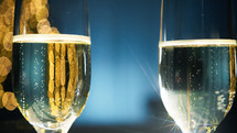 New Year background with sparkling wine glasses
