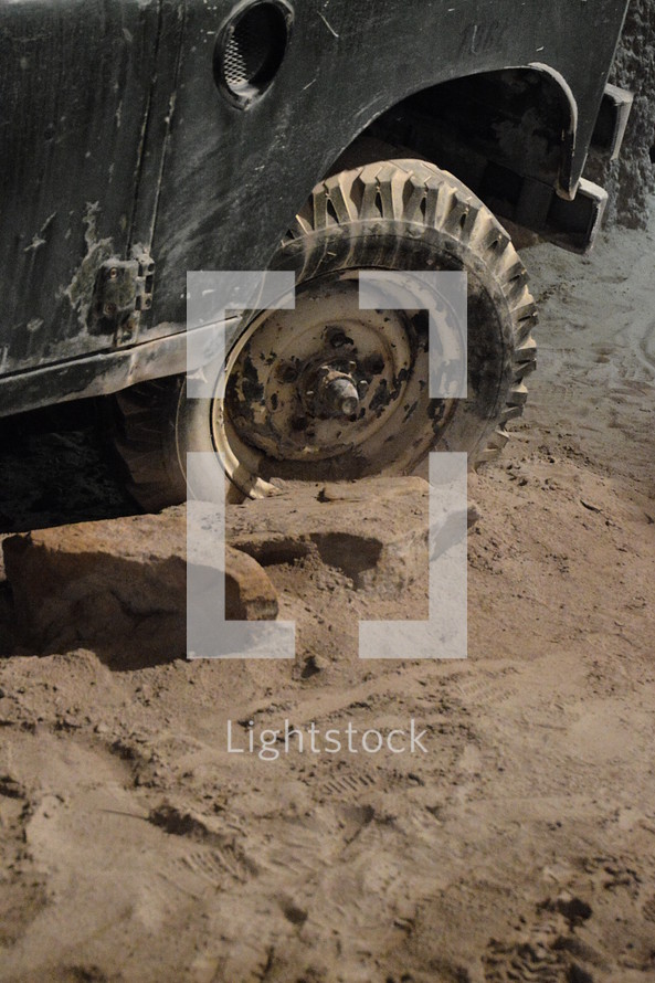 deadlocked – a car off-road on rough terrain. 
deadlocked, car, wheel, stuck, got stuck, sand, deep, gridlocked, stalemate, impasse, standstill, dead end, dug in, dig, digging, stick, sticking, stranded, wheels, wedged, marooned, spin, spinning, wheelspin, road, path, off-road, tire, tyre, vehicle, cross-country, country, ground, grounds, area, pathless, difficult, wayless, impassable, sink, bog down, bogged, descend, hopeless, desperate, desolate, hopelessly, wheeler, vessel, craft, automobile