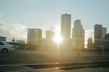 sunburst through city buildings 