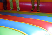 children bouncing in a bounce house