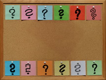 questions on a cork board 