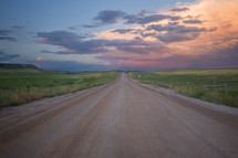 rural dirt road at sunset 
