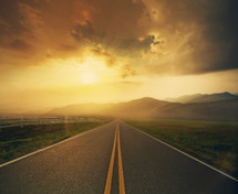 long road ahead at sunset 
