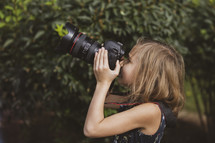 girl holding a camera 
