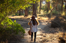 woman walking on a trail 
