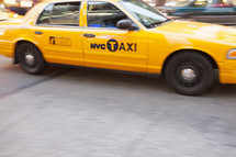 Yellow Taxi Cab in in motion, New York City, New York, USA. - for editorial use only.