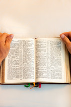 A person reading a Bible 