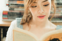teen girl reading a book 