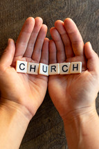 cupped hands with the word church 