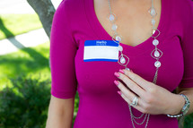 blank name tag on a woman