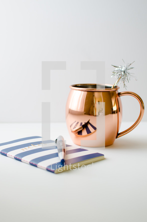 copper pitcher and journal