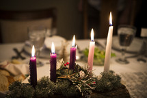 candles on a Christmas centerpiece 