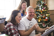 a family opening Christmas presents 